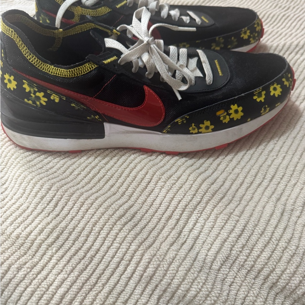 Nike Kids Black and Red Sneakers with Yellow Floral Accents